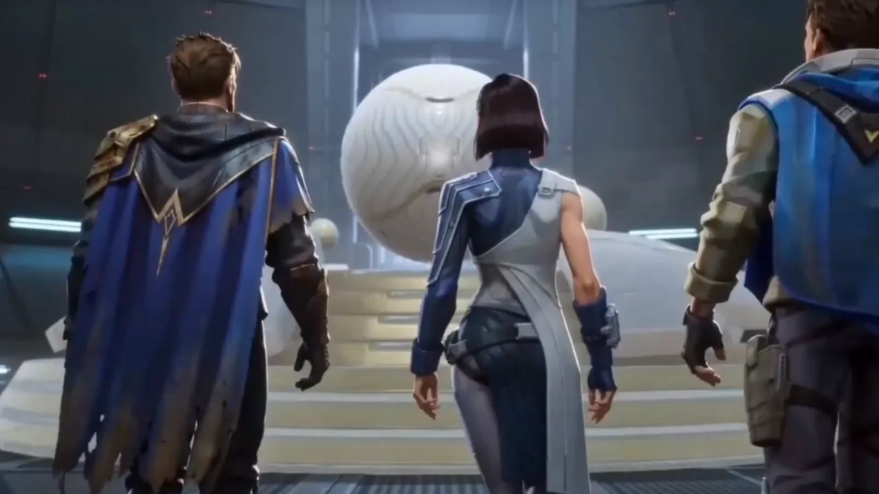 Three crew members in blue outfits seen from behind, walking toward a large white sphere in a hangar